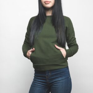 young woman in blank green sweatshirt on white